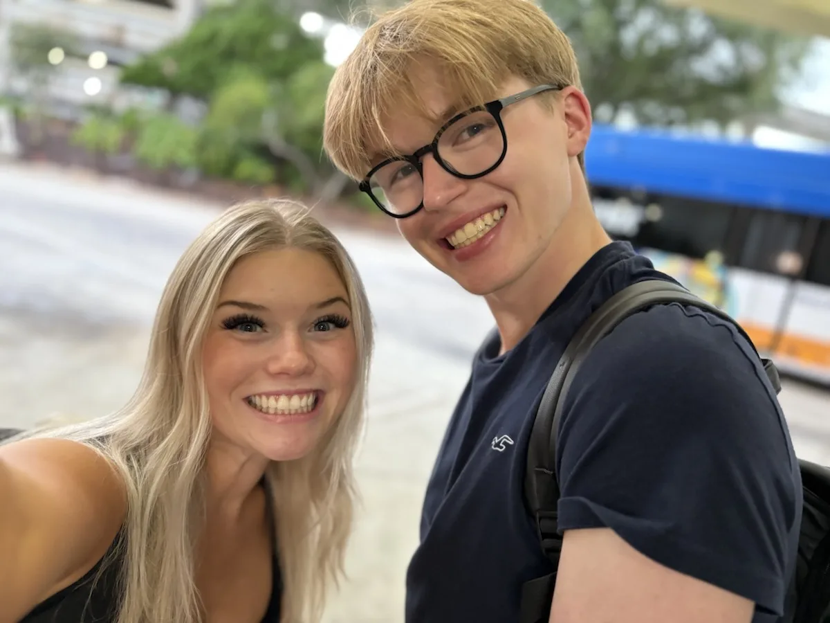 Matthew and Kelsey smiling while travelling